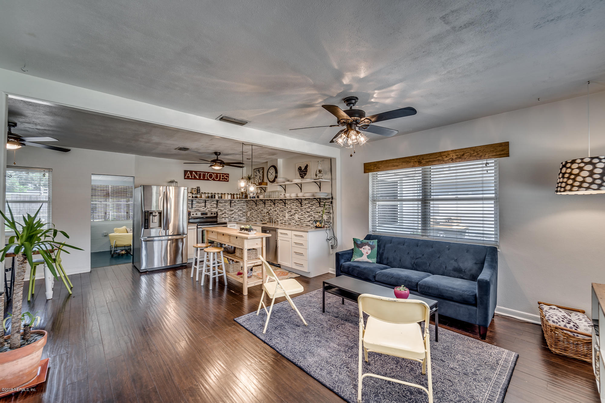 6124 Colgate Road Jacksonville, FL 32217 - Photo 18 of 26 a living room with furniture and a wooden floor