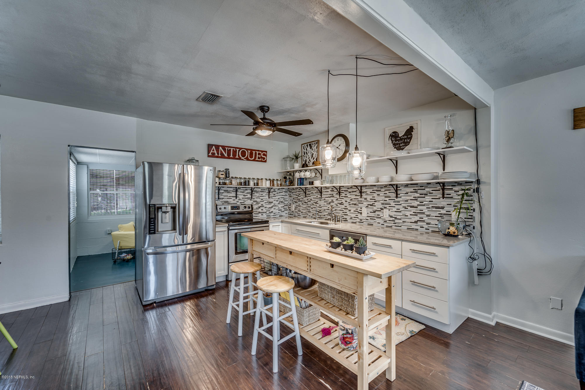 6124 Colgate Road Jacksonville, FL 32217 - Photo 19 of 26 a kitchen with a stove and a refrigerator