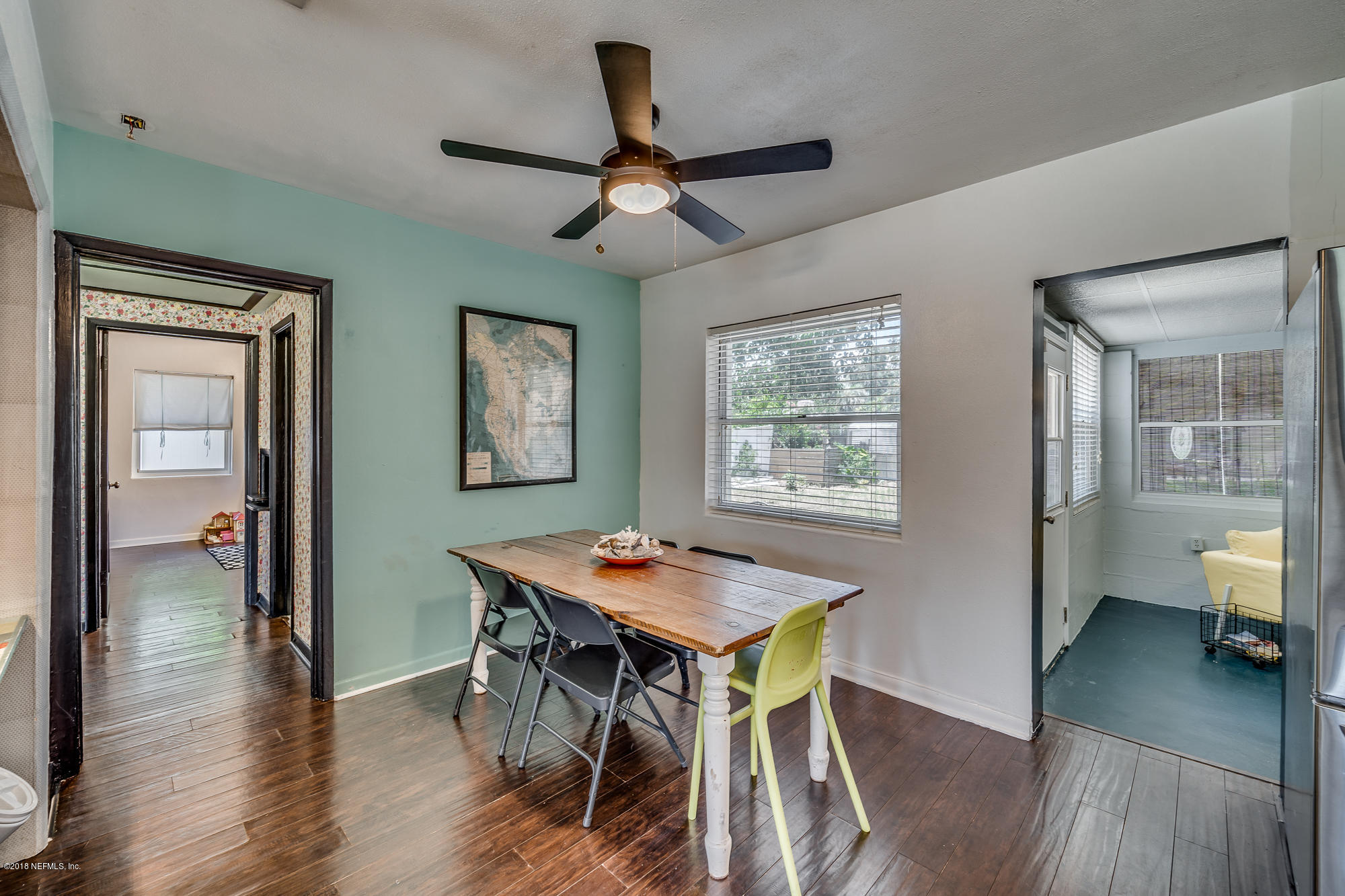 6124 Colgate Road Jacksonville, FL 32217 - Photo 22 of 26 a view of a dining room with furniture window and wooden floor
