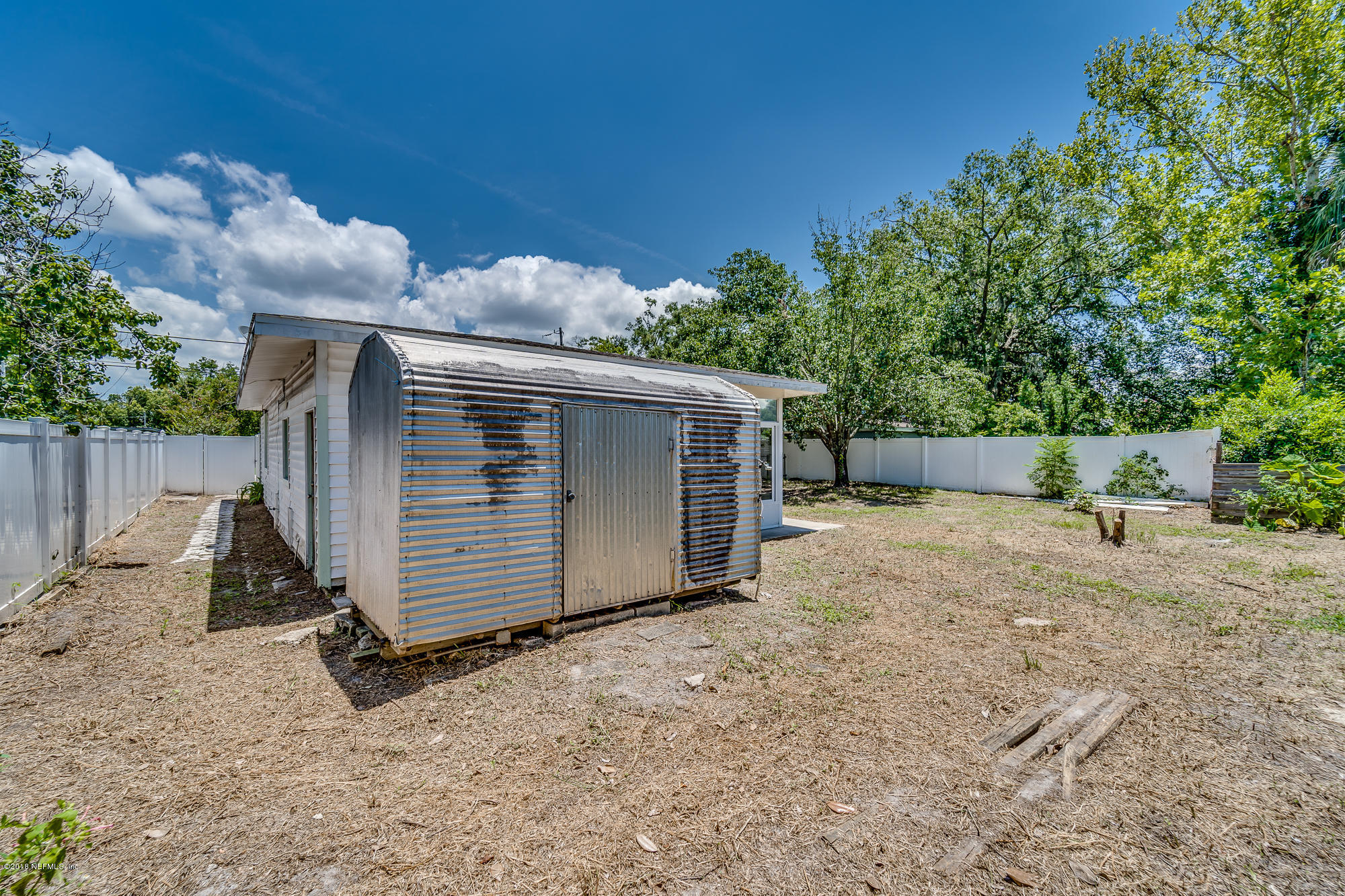 6124 Colgate Road Jacksonville, FL 32217 - Photo 8 of 26 a view of backyard and small cabin