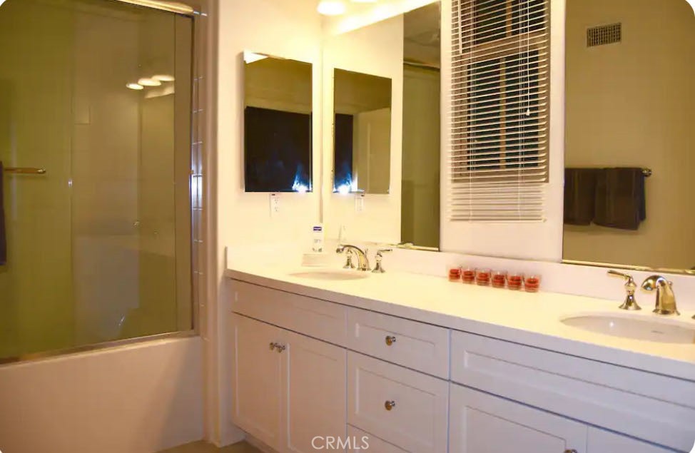 162 Overbrook Irvine, CA 92620 - Photo 11 of 27 a bathroom with a sink and a mirror