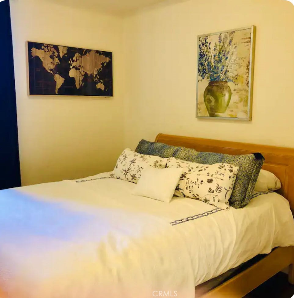 162 Overbrook Irvine, CA 92620 - Photo 10 of 27 a bedroom with a bed and painting on the wall