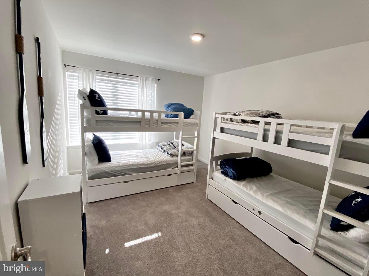 38035 Cross Gate Road Millville, DE 19967 - Photo 16 of 22 a living room with furniture and a couch