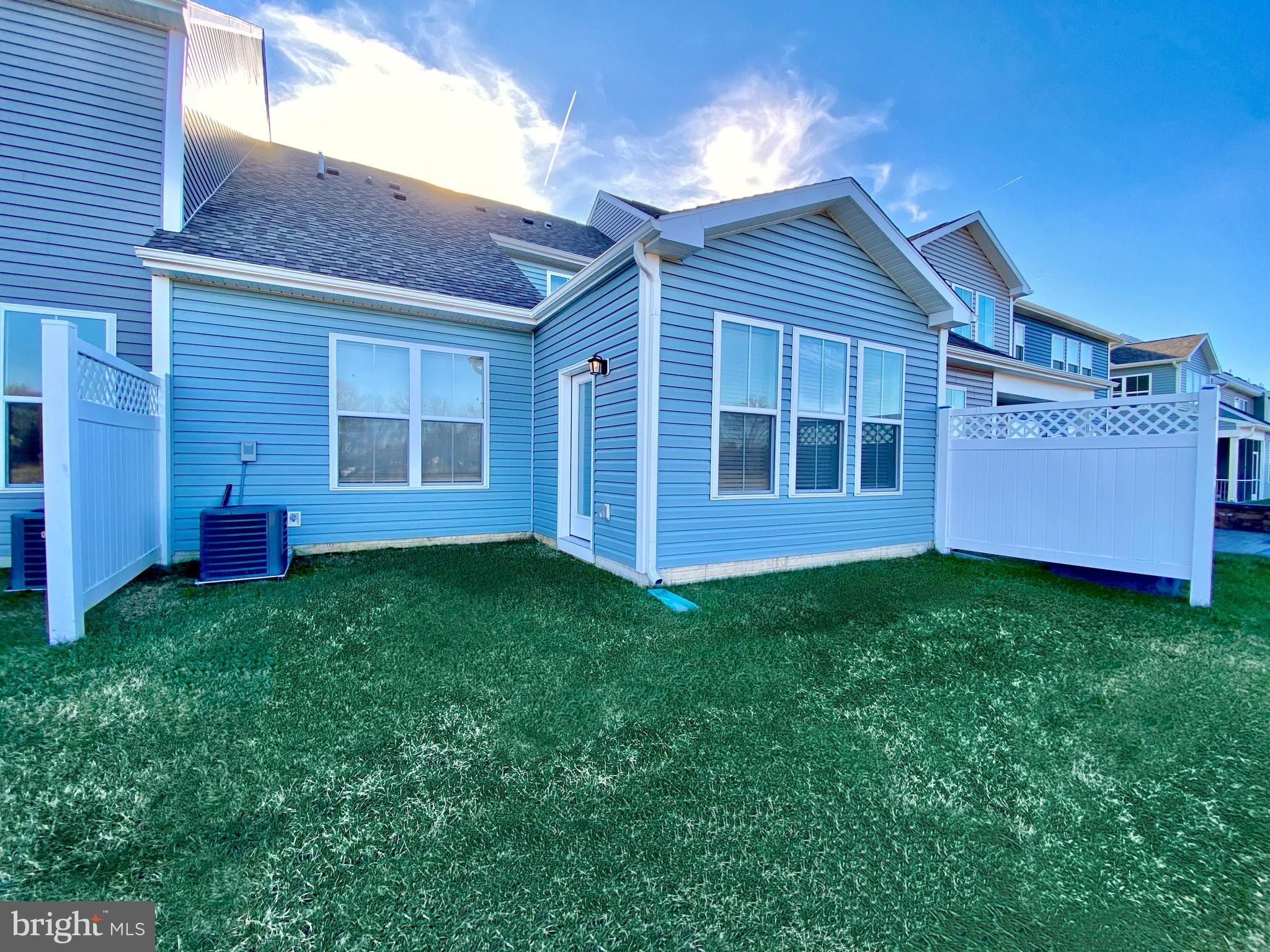 38035 Cross Gate Road Millville, DE 19967 - Photo 22 of 22 a view of a backyard with potted plants and large tree