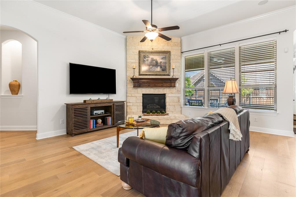 1112 Rhett Drive Colleyville, TX 76034 - Photo 16 of 40 a living room with fireplace furniture and a flat screen tv