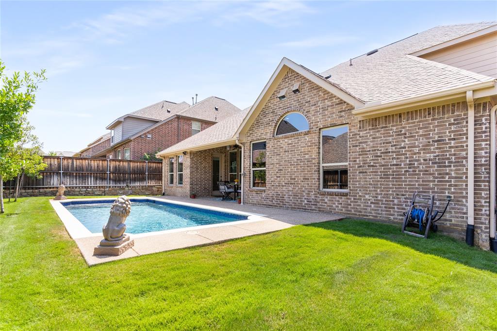 1112 Rhett Drive Colleyville, TX 76034 - Photo 2 of 40 a view of a house with a yard patio and swimming pool