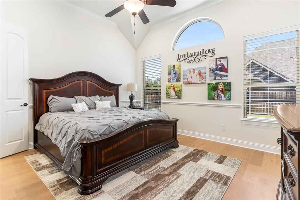 1112 Rhett Drive Colleyville, TX 76034 - Photo 21 of 40 a bedroom with a bed and a painting on the wall