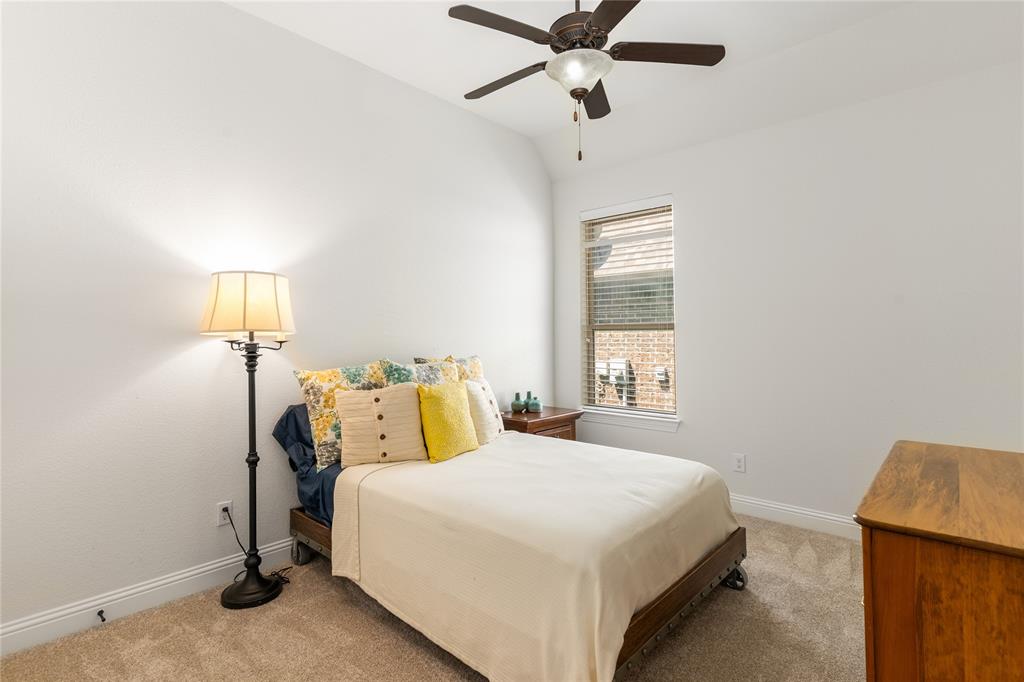 1112 Rhett Drive Colleyville, TX 76034 - Photo 27 of 40 a bedroom with a bed and a window