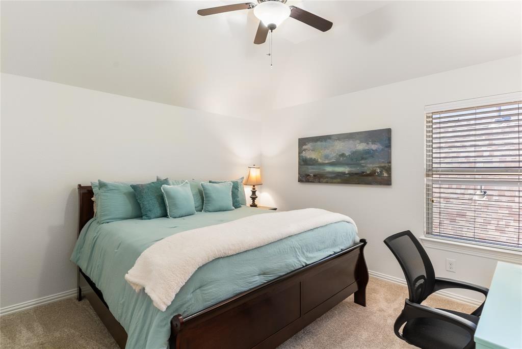 1112 Rhett Drive Colleyville, TX 76034 - Photo 28 of 40 a bedroom with a bed chair and window