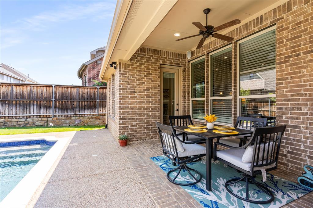 1112 Rhett Drive Colleyville, TX 76034 - Photo 34 of 40 a view of a patio with a table and chairs