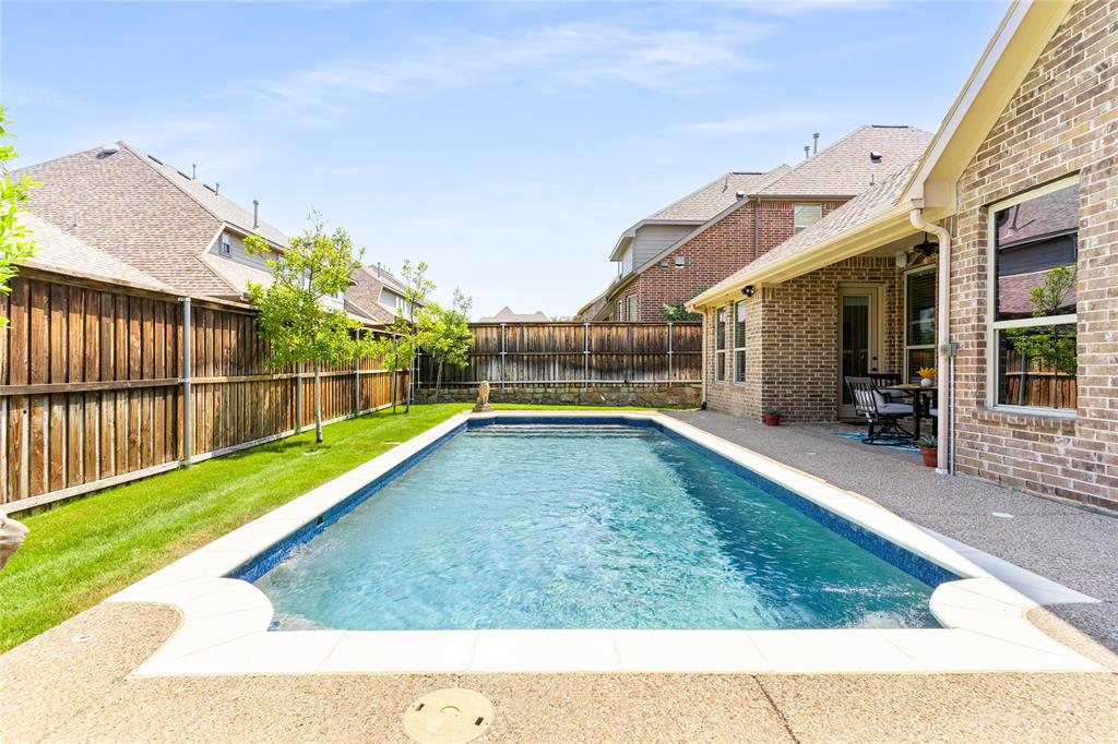 1112 Rhett Drive Colleyville, TX 76034 - Photo 35 of 40 a view of a backyard with a small pool