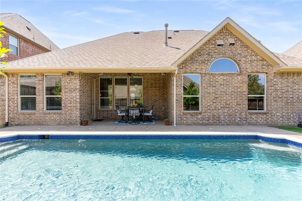 1112 Rhett Drive Colleyville, TX 76034 - Photo 36 of 40 a front view of a house with a yard and garage