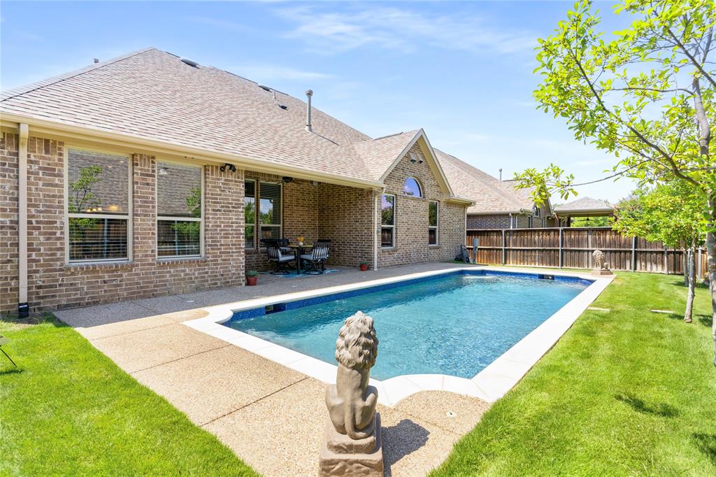 1112 Rhett Drive Colleyville, TX 76034 - Photo 37 of 40 a front view of a house with garden
