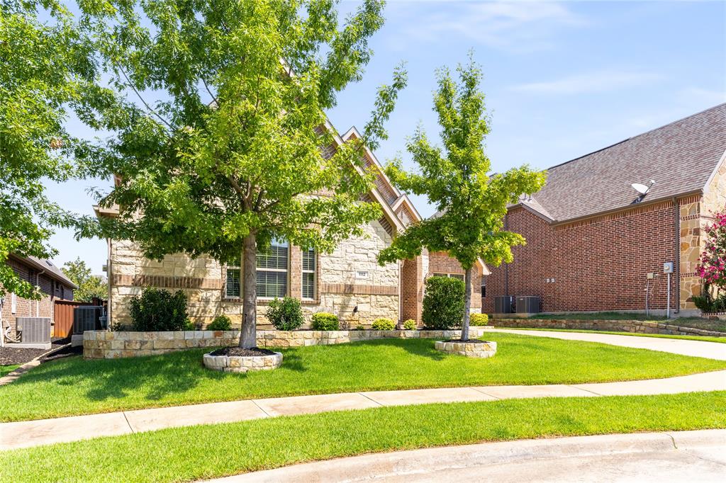 1112 Rhett Drive Colleyville, TX 76034 - Photo 4 of 40 a front view of a house with a yard