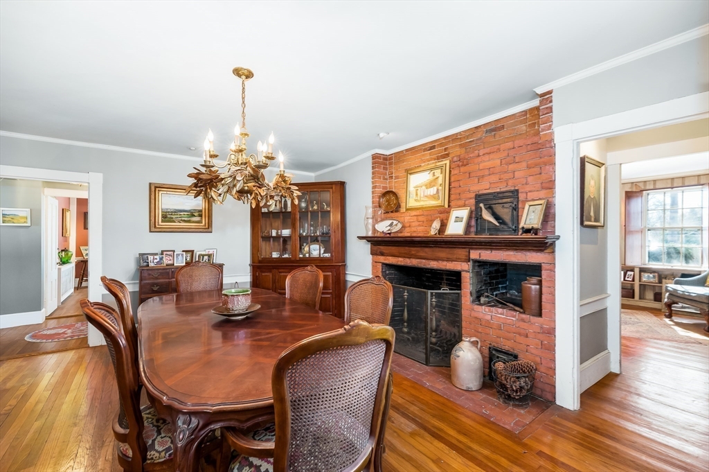 6 Northgate Road Ipswich, MA 01938 - Photo 13 of 42 a dining room with furniture a chandelier and wooden floor