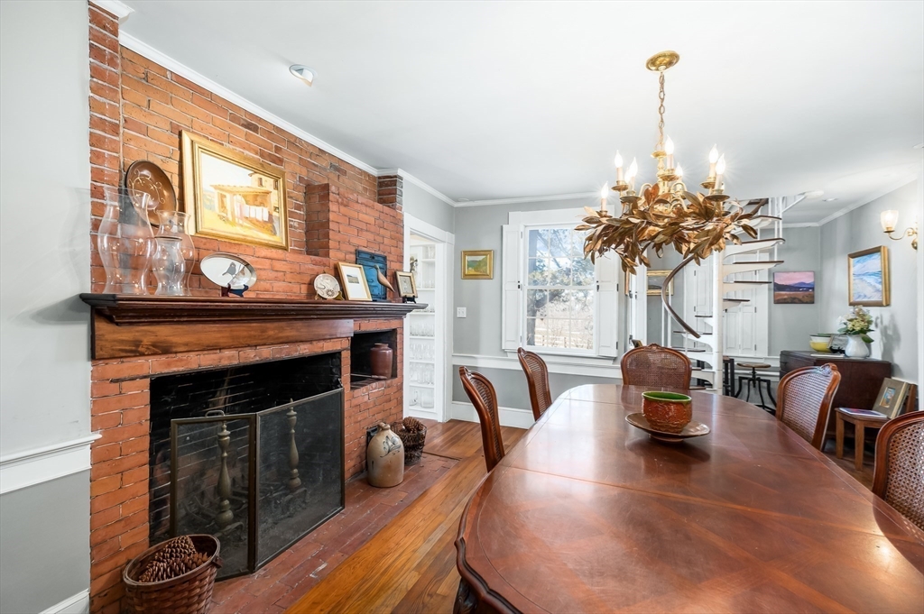 6 Northgate Road Ipswich, MA 01938 - Photo 14 of 42 a living room with furniture a chandelier and a fireplace