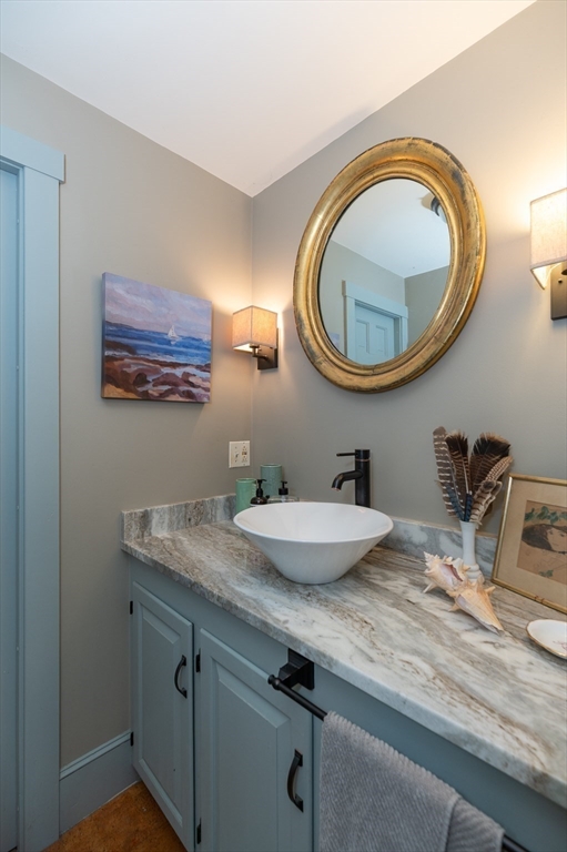 6 Northgate Road Ipswich, MA 01938 - Photo 22 of 42 a bathroom with a sink and a mirror