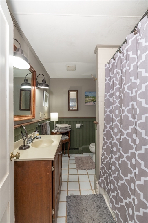 6 Northgate Road Ipswich, MA 01938 - Photo 27 of 42 a bathroom with a sink and a mirror