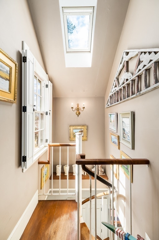 6 Northgate Road Ipswich, MA 01938 - Photo 29 of 42 a view of a hallway with wooden floor and staircase