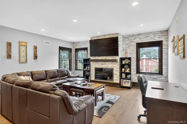 a kitchen with stainless steel appliances granite countertop a stove top oven a sink dishwasher and a refrigerator