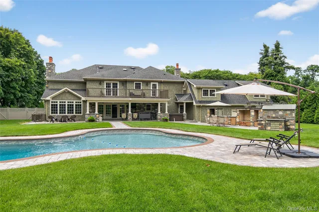 a view of a swimming pool and a yard