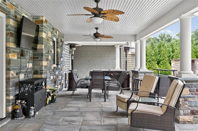 an aerial view of a house with outdoor space pool seating area and yard