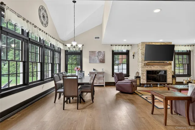 a living room with furniture fireplace and flat screen tv