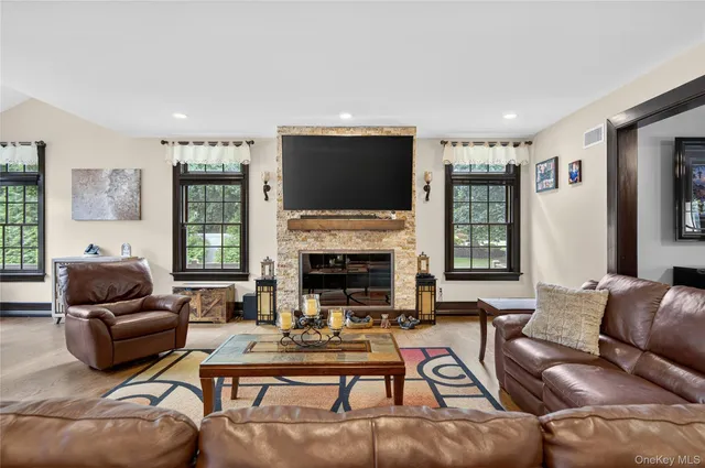 a kitchen with stainless steel appliances kitchen island granite countertop a sink and cabinets
