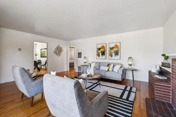 a kitchen with a table chairs stove and cabinets