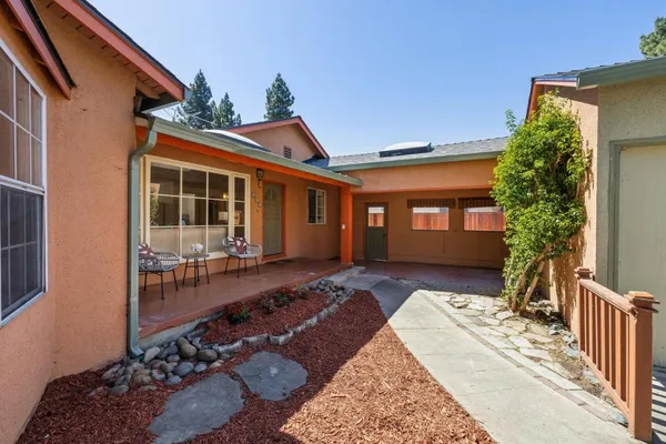 a kitchen with sink cabinets and wooden floor