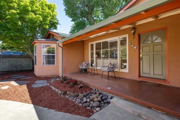 a kitchen with cabinets appliances and a window