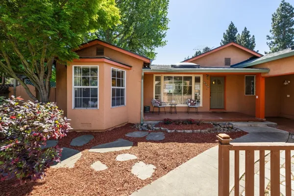 a front view of a house with garden