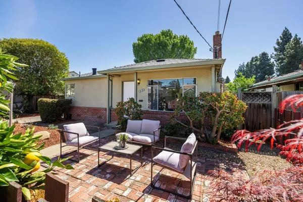 a view of a patio with couches and potted plants