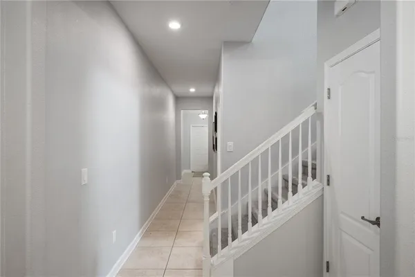 a view of a hallway with windows