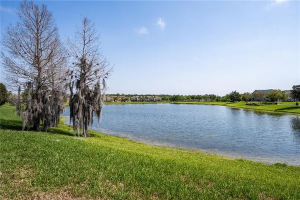 a view of a lake with a big yard