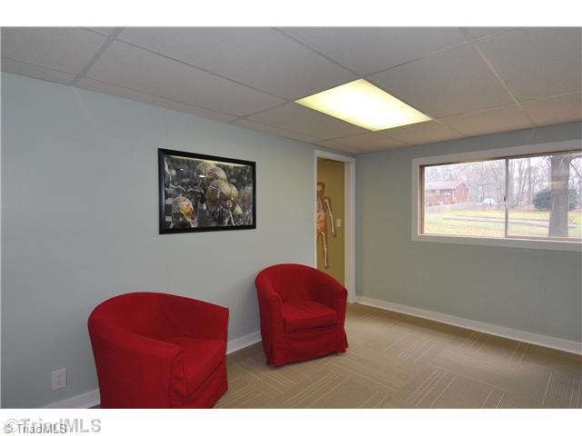 9045 Fantasy Road Lewisville, NC 27023 - Photo 13 of 15 Other. Basement sitting area between playroom and office