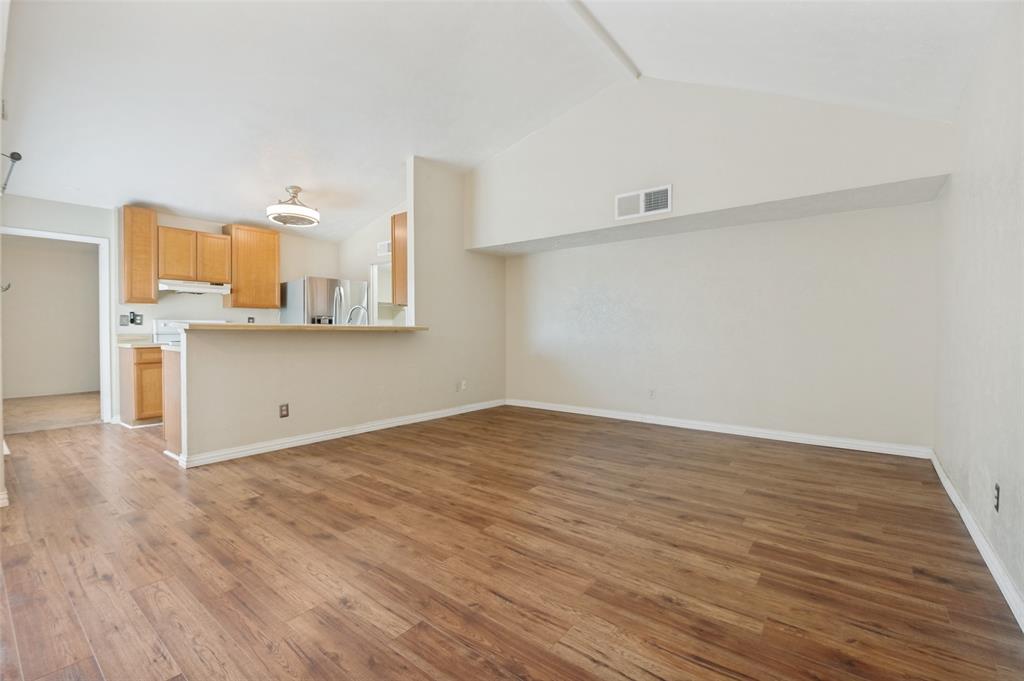 7305 Pineberry Road Dallas, TX 75249 - Photo 6 of 25 a view of kitchen with wooden floor