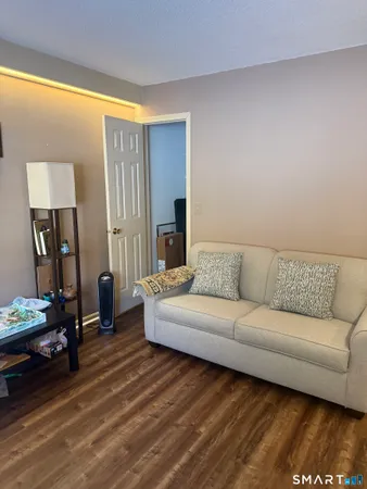 a living room with a couch and a flat screen tv