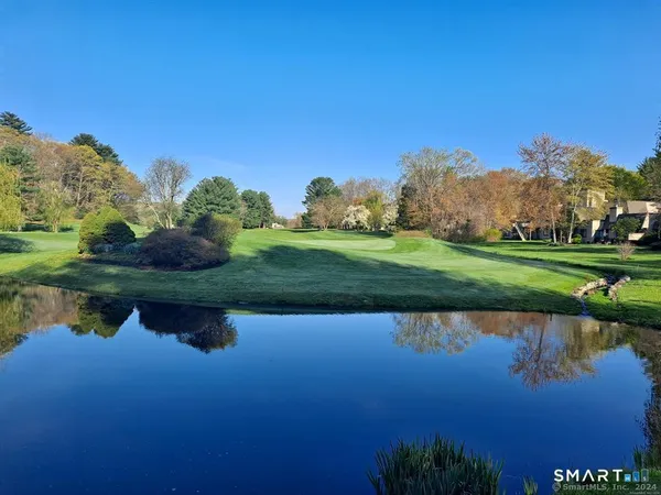 a bedroom with a bed and a table
