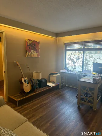 a spacious bedroom with a large window