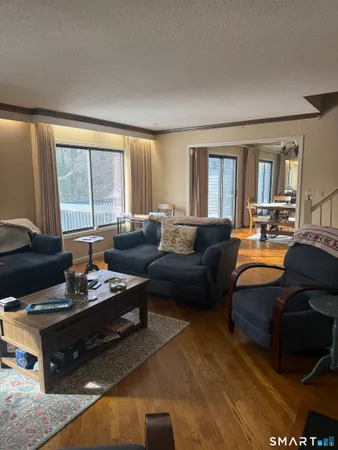 a living room with dining table and chairs