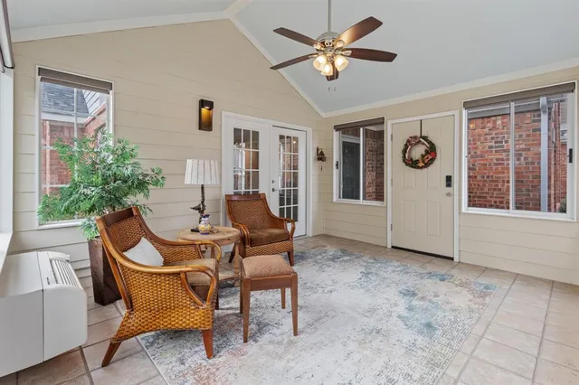 a view of a livingroom with furniture and a ceiling fan