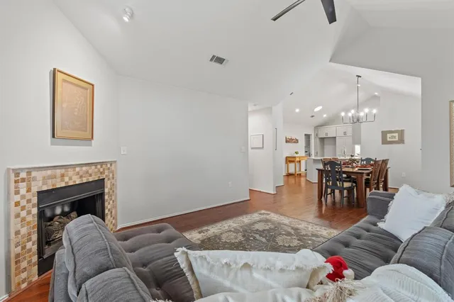 a living room with furniture or kitchen view and a fireplace