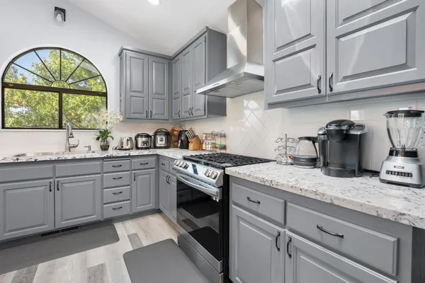 a kitchen with sink cabinets and window