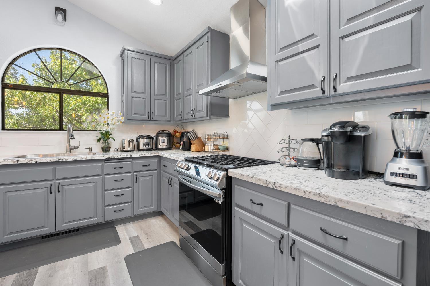 8170 Grizzly Flat Road Somerset, CA 95684 - Photo 14 of 43 a kitchen with sink cabinets and window