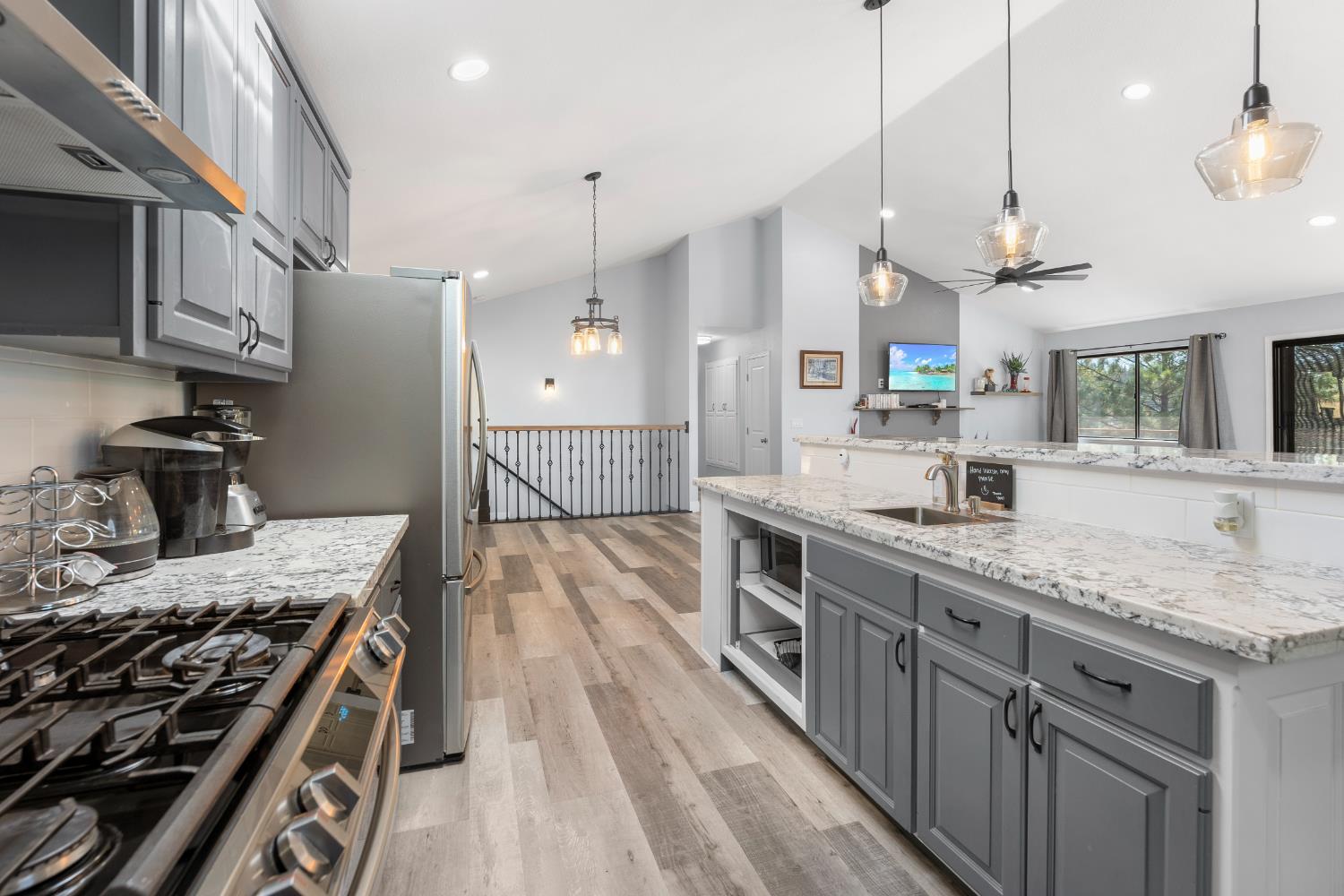 8170 Grizzly Flat Road Somerset, CA 95684 - Photo 15 of 43 a kitchen with a stove and a wooden floors