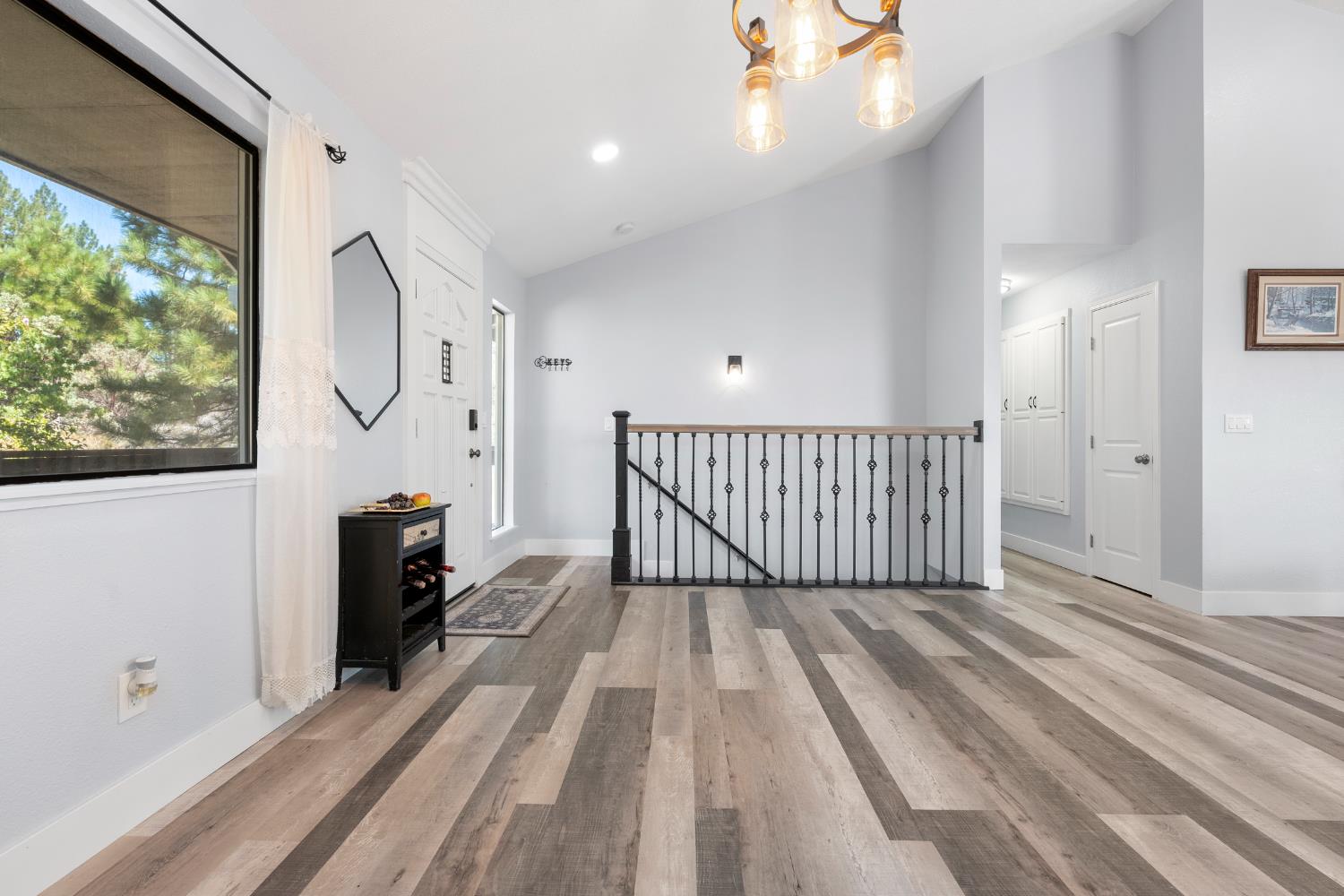 8170 Grizzly Flat Road Somerset, CA 95684 - Photo 18 of 43 a view of a room with wooden floor and windows