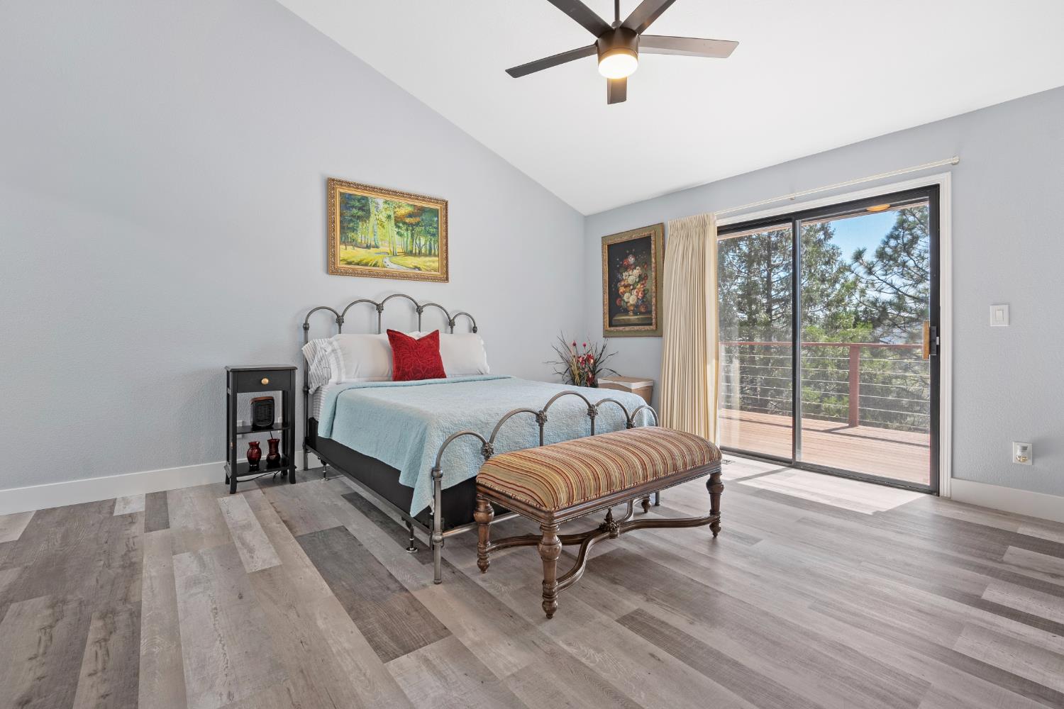 8170 Grizzly Flat Road Somerset, CA 95684 - Photo 20 of 43 a bedroom with a bed and wooden floor