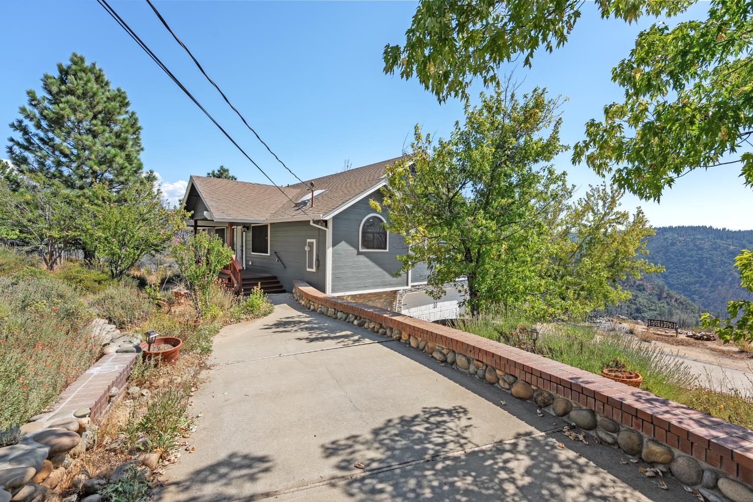 8170 Grizzly Flat Road Somerset, CA 95684 - Photo 2 of 43 a house with trees in the background