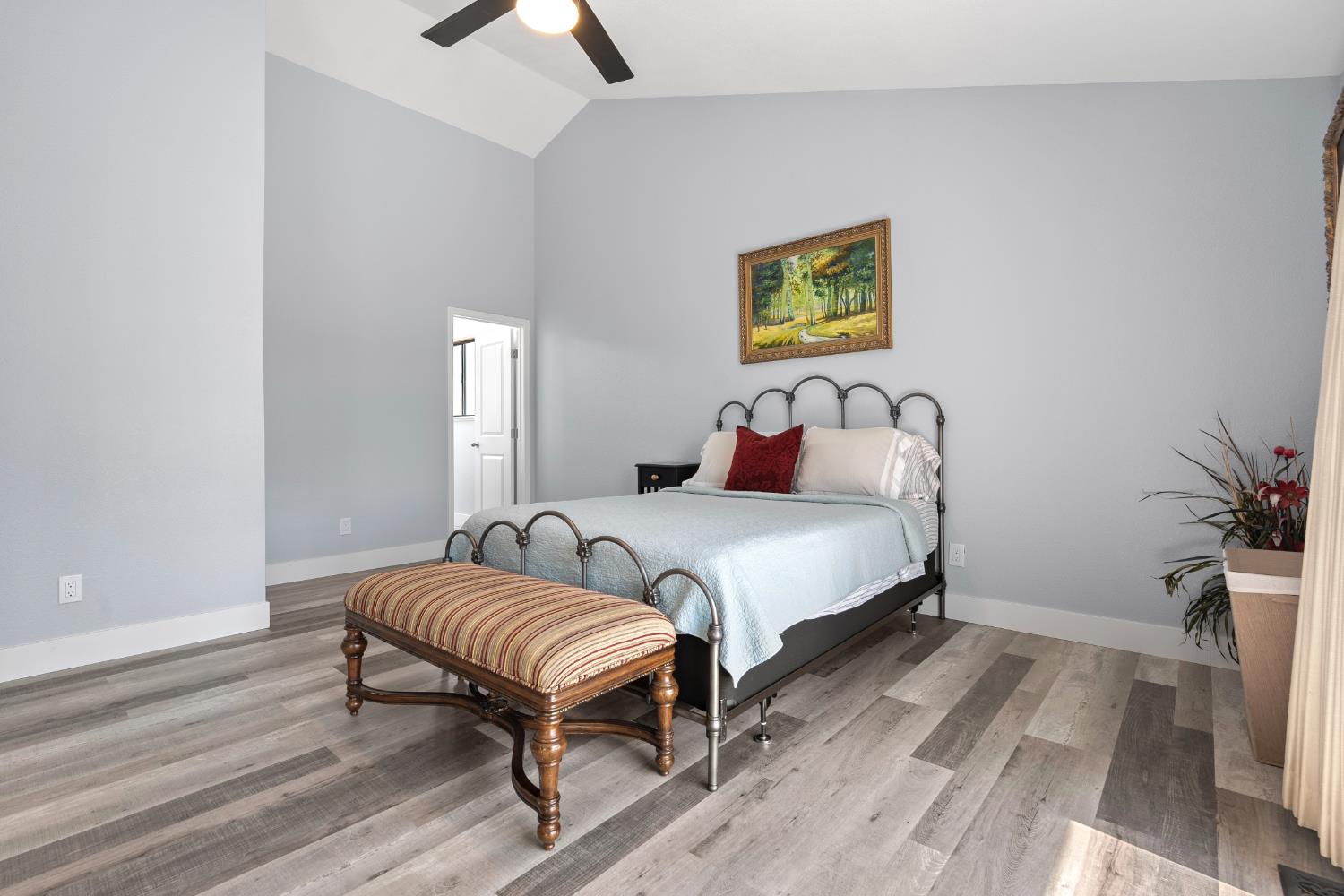 8170 Grizzly Flat Road Somerset, CA 95684 - Photo 21 of 43 a bedroom with a bed and a potted plant